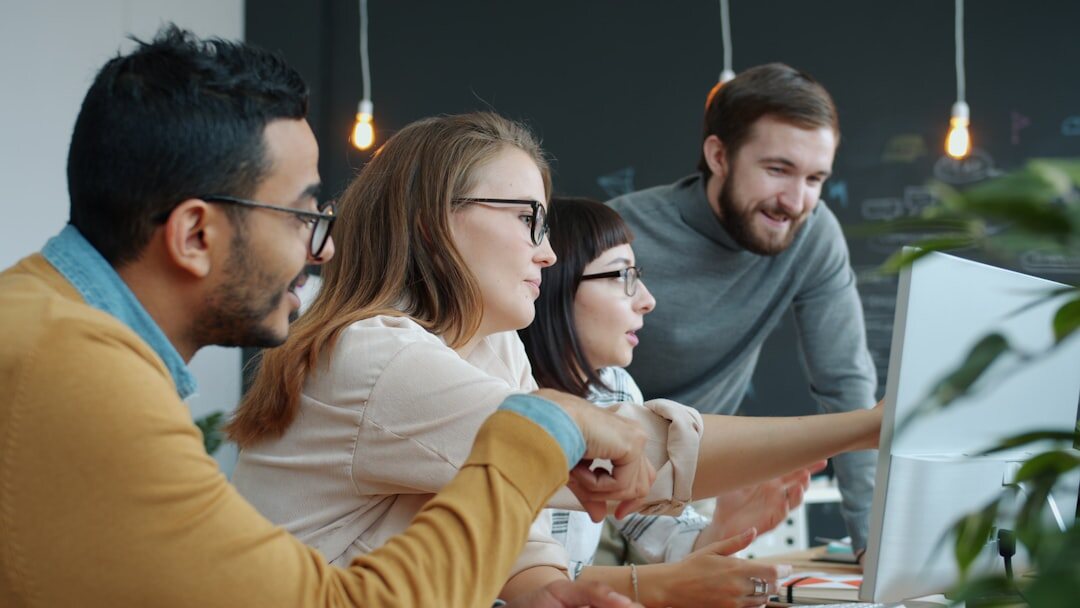 Modern startup office with diverse team working at computers